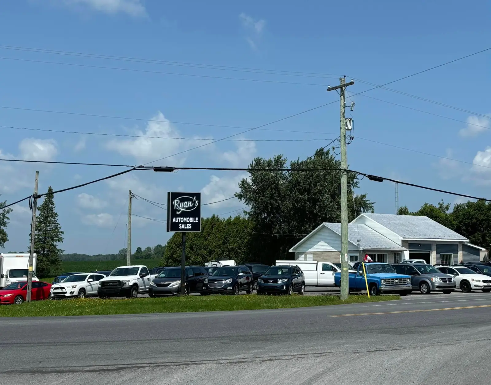 Used trucks and SUVs on the lot at Ryan's Auto Sales in Maxville, Ontario